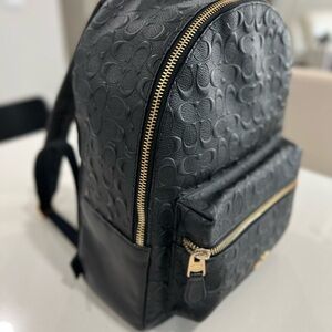 Black Embossed Backpack with Gold Zipper